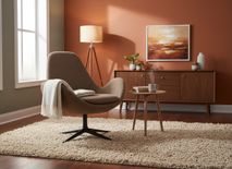 Lage fauteuil Ghost, bekleed met bruin grijsbruin stof op een zwart onderstel.