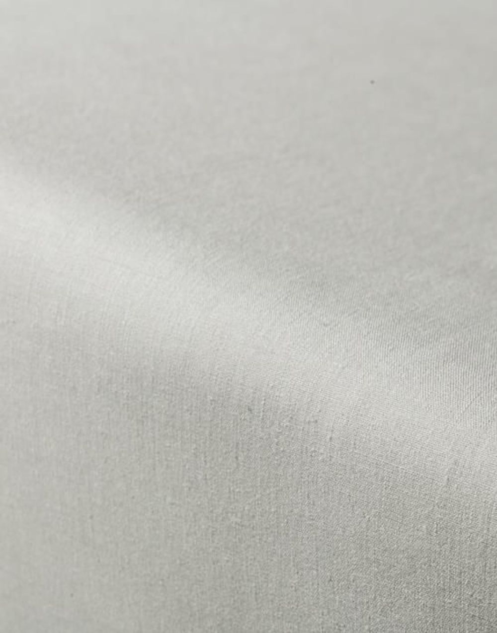 Close-up van petrolkleurig percal hoeslaken toont de fijne textuur.