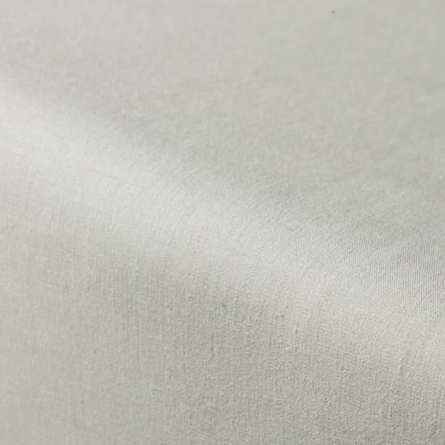 Close-up van petrolkleurig percal hoeslaken toont de fijne textuur.