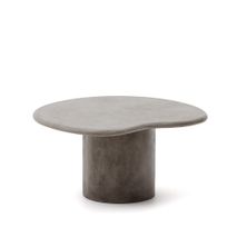 Ronde salontafel van grijs beton op een donkere cilindervormige voet.