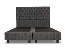 Boxspring DINANT 160 cm met gestoffeerd hoofdbord en bedbodems van donkergrijs textiel.