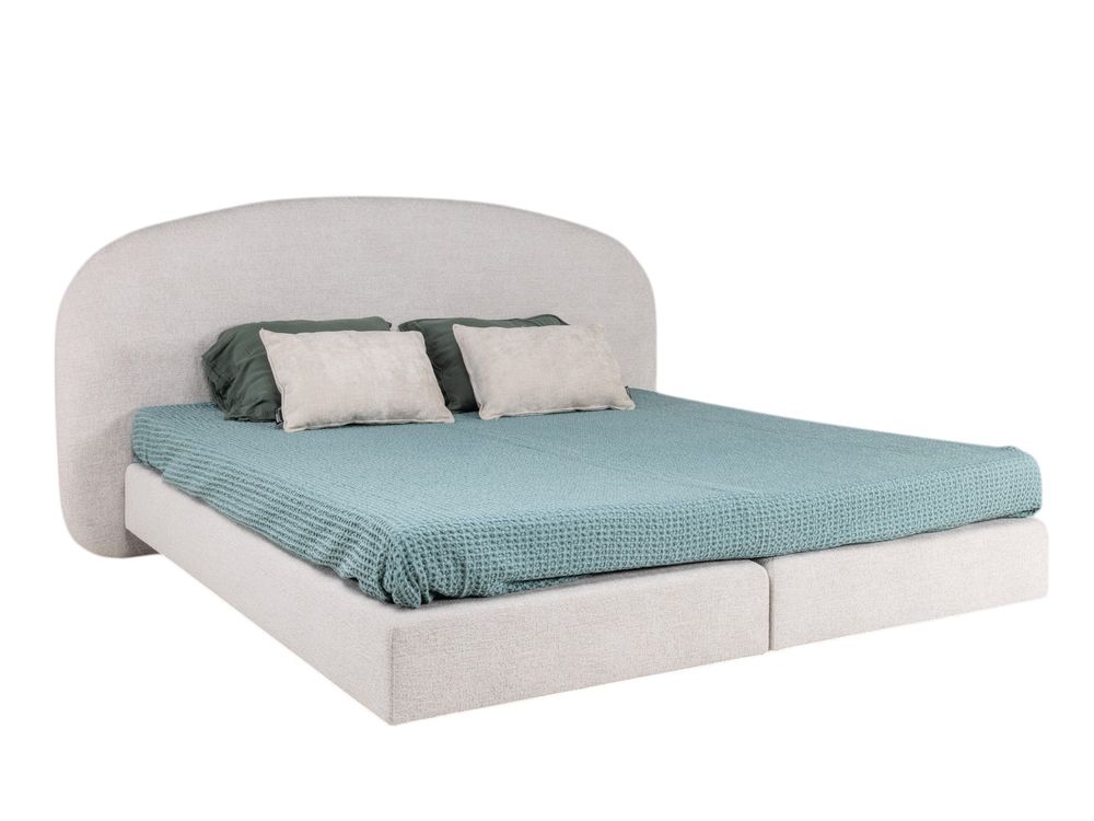Boxspring ASPEN met beige teddy bekleding en een mintgroen dekbed.