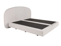 Boxspring ASPEN met beige stoffen bekleding en afgerond hoofdeinde.