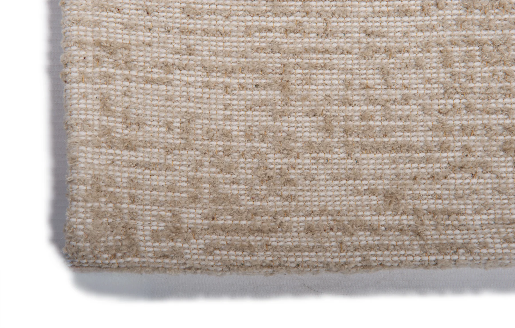 Tapijt OASIS Ecru, gemaakt van wol en viscose.
